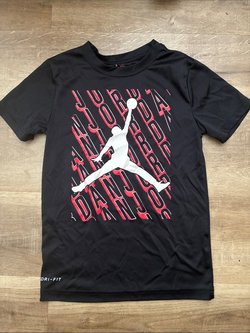 Jordan Black Short Sleeve Tee with White Jumpman and Red Graphic (youth L)